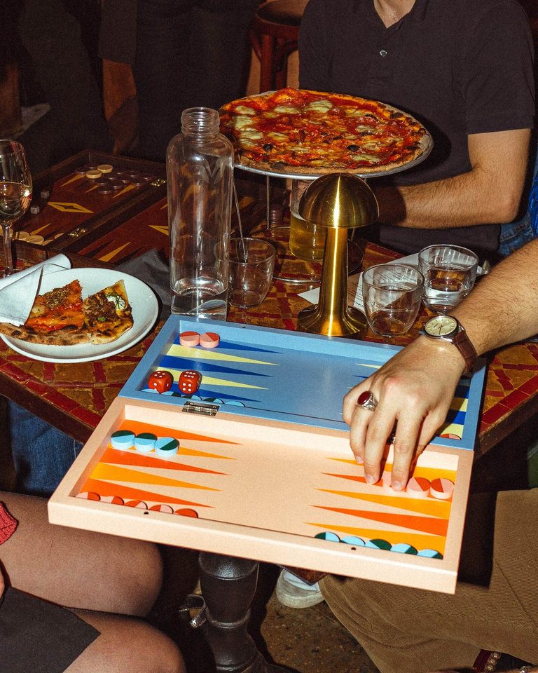 Players deep in concentration over a board