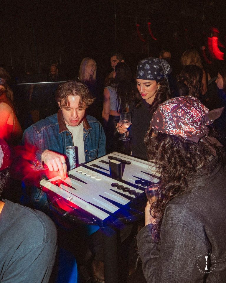 Club members playing backgammon at an NYC venue